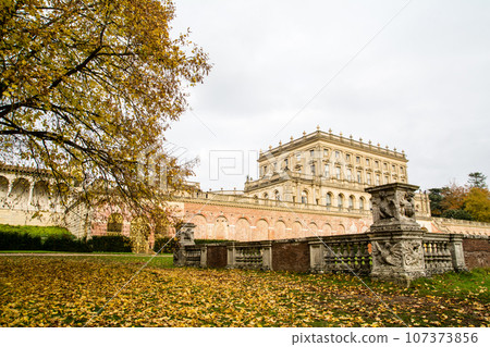 Cliveden Manor House, a historic building made of stone and red brick under a cloudy sky Cliveden Manor House, a historic building made of stone and red brick under a cloudy sky 107373856