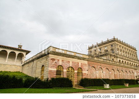 Cliveden Manor House, a historic building made of stone and red brick under a cloudy sky 107373858