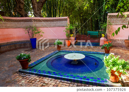 Small fountain in the entreance of Majorelle garden in Marrakesh Small fountain in the entreance of Majorelle garden in Marrakesh 107375926