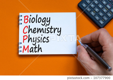 BCPM biology chemistry physics math symbol. Concept words BCPM biology chemistry physics math on the note on beautiful orange background. Business BCPM biology chemistry physics math concept. 107377900