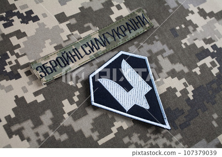 KYIV, UKRAINE - October 6, 2022. Russian invasion in Ukraine 2022. The Special Operations Forces of Ukraine Army uniform insignia badges. Text in Ukrainian - Armed Forces of Ukraine. KYIV, UKRAINE - October 6, 2022. Russian invasion in Ukraine 2022. The Special Operations Forces of Ukraine Army uniform insignia badges. Text in Ukrainian - Armed Forces of Ukraine. 107379039