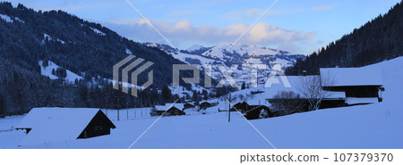 Saanenland Valley on a winter evening. Saanenland Valley on a winter evening. 107379370