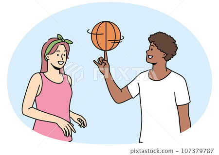 Happy multiethnic couple play basketball 107379787