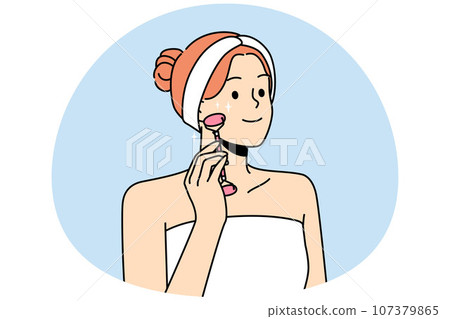 Smiling woman do face roller massage Smiling woman do face roller massage 107379865