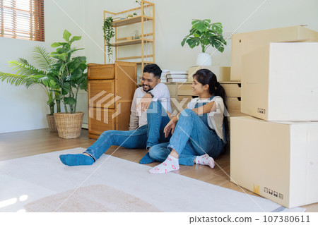Married couple moving in new property bought together on mortgage loan Married couple moving in new property bought together on mortgage loan 107380611
