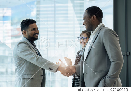 Closeup Handshake of employees after successful planning strategy marketing in the office Closeup Handshake of employees after successful planning strategy marketing in the office 107380613