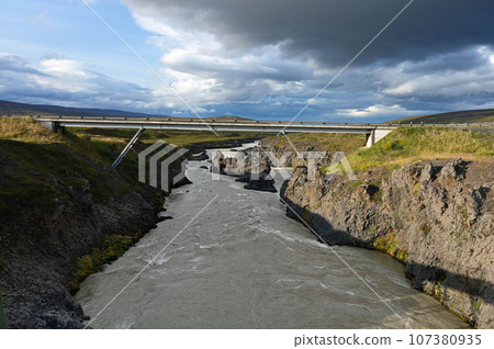 Godafoss Falls and Skjalfandafljot River in northern Iceland under autumn sky. 107380935