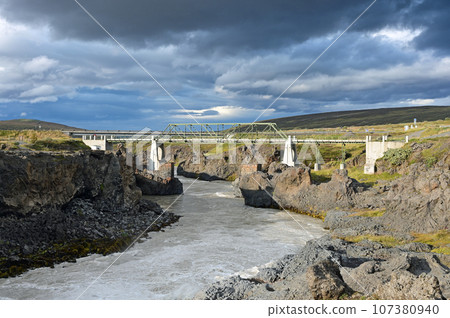 Godafoss Falls and Skjalfandafljot River in northern Iceland under autumn sky. 107380940