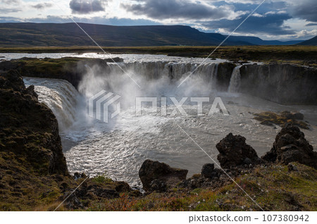 Godafoss Falls and Skjalfandafljot River in northern Iceland under autumn sky. 107380942
