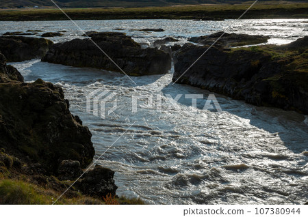 Godafoss Falls and Skjalfandafljot River in northern Iceland under autumn sky. 107380944