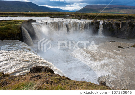 Godafoss Falls and Skjalfandafljot River in northern Iceland under autumn sky. 107380946