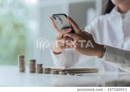 Asian woman hand using mobile phone with online income, Concept financial technology fintech Asian woman hand using mobile phone with online income, Concept financial technology fintech 107380953
