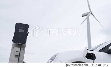 Progressive combination of EV car, charging station and wind turbine. 107381037