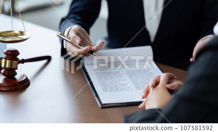 Lawyer, legal advisor, businessperson explaining agreement details Business contracts Lawyer, legal advisor, businessperson explaining agreement details Business contracts 107381592