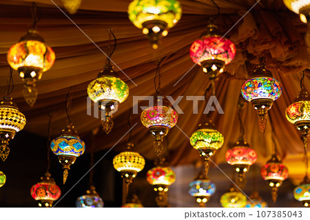 Traditional handmade multicolor Turkish, Moroccan, Arabian lamps hanging for Ramadan Kareem greeting. 107385043