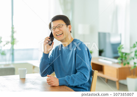 Senior man calling on smartphone Senior man calling on smartphone 107385807