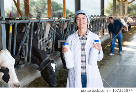 Portrait of woman quality expert who is standing Portrait of woman quality expert who is standing 107385874