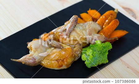 Teriyaki partridge with grilled carrots 107386086