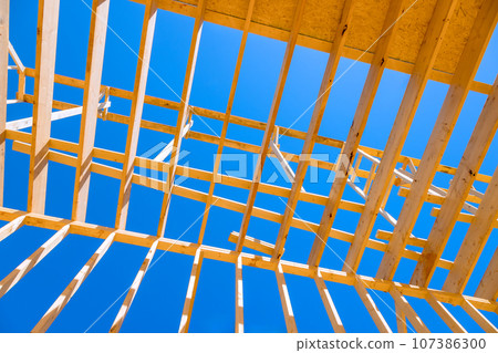 New house frame truss wooden roof beams support 107386300