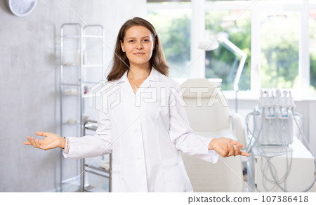 Young female doctor posing in medical room 107386418