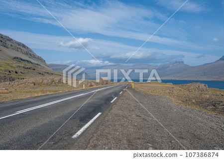 View of Berufjordur fjord and surrounding mountains from Ring Road, Iceland. View of Berufjordur fjord and surrounding mountains from Ring Road, Iceland. 107386874