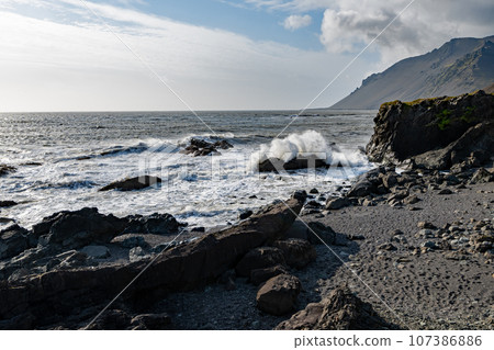 Rugged east coast of Iceland on sunny autumn morning with very strong wind. 107386886