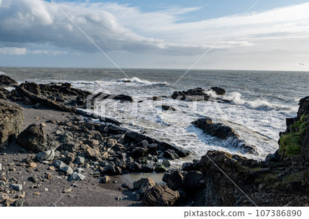 Rugged east coast of Iceland on sunny autumn morning with very strong wind. 107386890