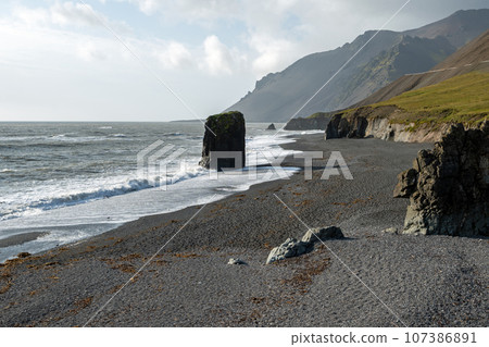 Rugged east coast of Iceland on sunny autumn morning with very strong wind. 107386891