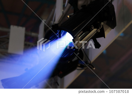 LED stage spotlight fixture and ray of blue light 107387018