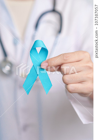 Blue November Prostate Cancer Awareness month, Doctor with Blue Ribbon in hospital for support people life and illness. Healthcare, International men, Father, Diabetes and World cancer day 107387057