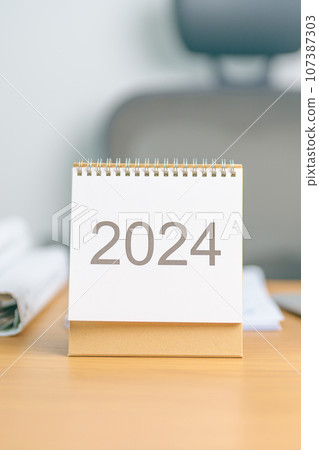 2024 Year Calendar on table background. countdown, Happy New Year, Resolution, Goals, Plan, Action, Mission and financial Concept 2024 Year Calendar on table background. countdown, Happy New Year, Resolution, Goals, Plan, Action, Mission and financial Concept 107387303
