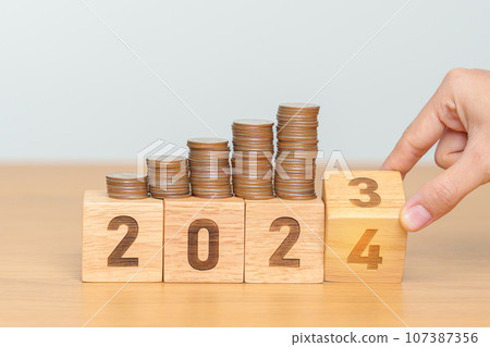 flipping 2023 to 2024 year block with Coins stack. Money, Budget, tax, investment, financial, savings and New Year Resolution concepts flipping 2023 to 2024 year block with Coins stack. Money, Budget, tax, investment, financial, savings and New Year Resolution concepts 107387356