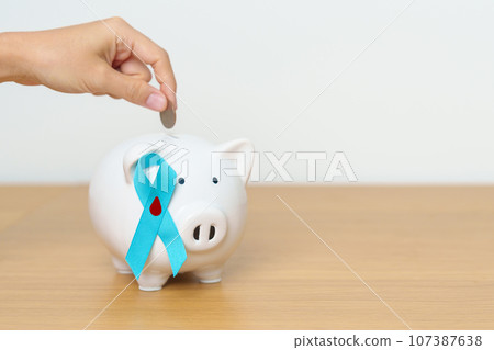 Blue November Diabetes and Prostate Cancer Awareness month, Blue Ribbon with Piggy Bank for support illness life. Health, Donation, Charity, Campaign, Money Saving, Fund, International men, Father day Blue November Diabetes and Prostate Cancer Awareness month, Blue Ribbon with Piggy Bank for support illness life. Health, Donation, Charity, Campaign, Money Saving, Fund, International men, Father day 107387638