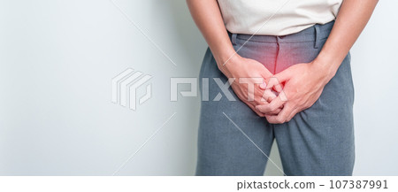 Older Man having Prostate gland or Urinary bladder pain. Prostate Cancer, Enlarged prostate, Prostatitis disease, Hypothyroidism, Male Infertility, Health and World cancer day concept 107387991
