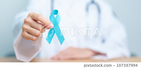 Blue November Prostate Cancer Awareness month, Doctor with Blue Ribbon in hospital for support people life and illness. Healthcare, International men, Father, Diabetes and World cancer day Blue November Prostate Cancer Awareness month, Doctor with Blue Ribbon in hospital for support people life and illness. Healthcare, International men, Father, Diabetes and World cancer day 107387994