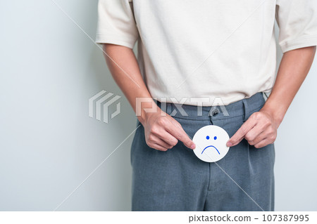 Older Man holding bad Mood paper on Prostate gland or Urinary bladder. Prostate Cancer, Enlarged prostate, Prostatitis disease, Hypothyroidism, Male Infertility, Health and World cancer day 107387995