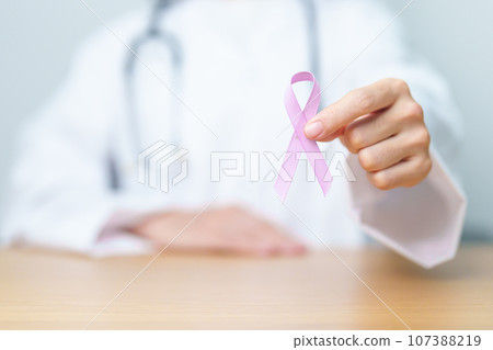 Doctor holding Purple Ribbon for Stomach, Violence, Pancreatic, Esophageal, Testicular cancer, Alzheimer, epilepsy, lupus, Sarcoidosis and Fibromyalgia. Awareness month and World cancer day concept Doctor holding Purple Ribbon for Stomach, Violence, Pancreatic, Esophageal, Testicular cancer, Alzheimer, epilepsy, lupus, Sarcoidosis and Fibromyalgia. Awareness month and World cancer day concept 107388219