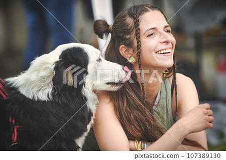 Young girl with her inseparable Australian shepherd dog 107389130
