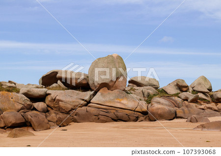 Bizarre boulders and rocks on the Pink Granite Coast on the island of Renote in Brittany 107393068