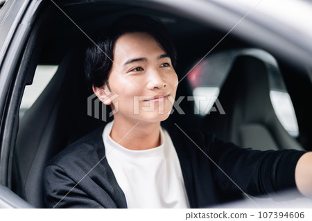 young man going out by car 107394606