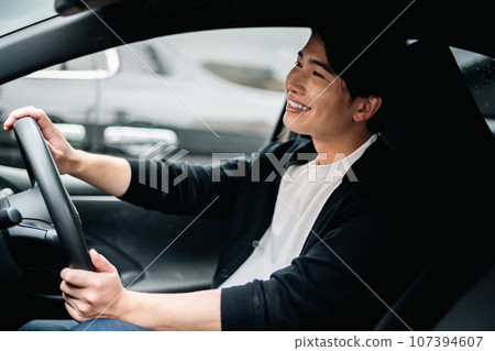 young man going out by car 107394607