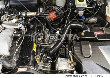 Engine of a modern car. Device and detailing of the transport motor.Automotive, motors, manufacturing concept. Engine of a modern car. Device and detailing of the transport motor.Automotive, motors, manufacturing concept. 107394792