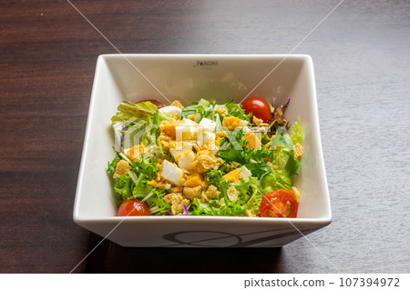 Mimosa style vegetable salad 107394972