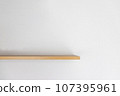 Empty wooden wall shelf on white background. 107395961