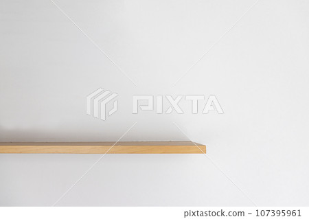 Empty wooden wall shelf on white background. Empty wooden wall shelf on white background. 107395961