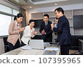 Business man and woman work together, celebrate success in start up office. Creative team brainstorm meeting, businesspeople colleague partnership concept 107395965