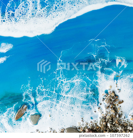 Resin art with blue ocean waves and stone beach. Epoxy art composition Resin art with blue ocean waves and stone beach. Epoxy art composition 107397262