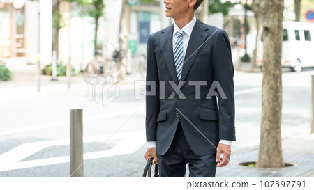 Walking senior man business Walking senior man business 107397791