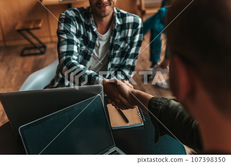 Handshaking of business people in office as concept of teamwork and partnership Handshaking of business people in office as concept of teamwork and partnership 107398350