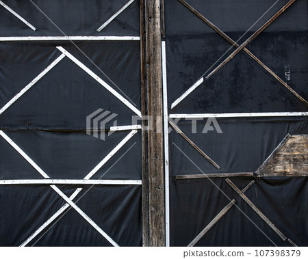 Black old surface made of boards and fabric 107398379